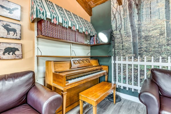 Interior common area with a piano and cozy seating