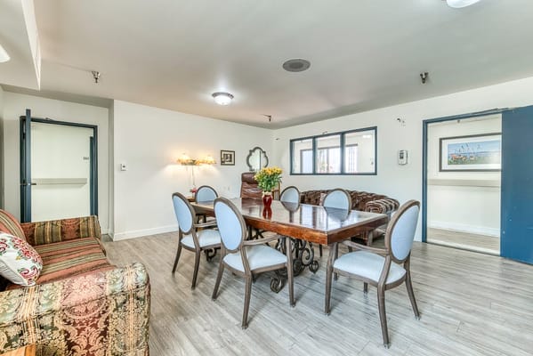 A common area with dining table and seating