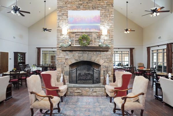 Interior view of a cozy common area with a fireplace