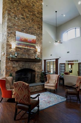 Interior common area with seating and stone fireplace