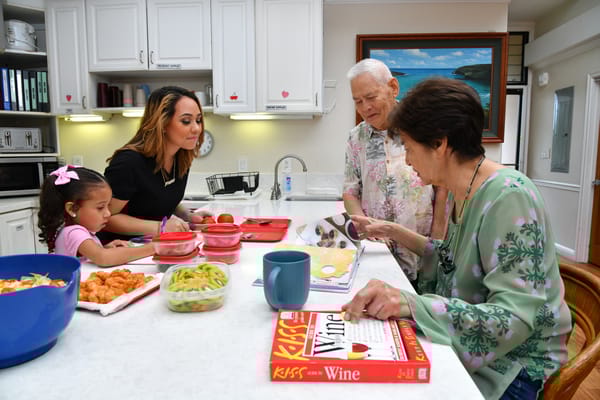 Residents preparing food in a kitchen setting
