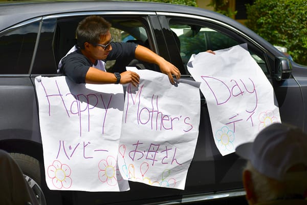 Resident celebrating Mother's Day from a vehicle