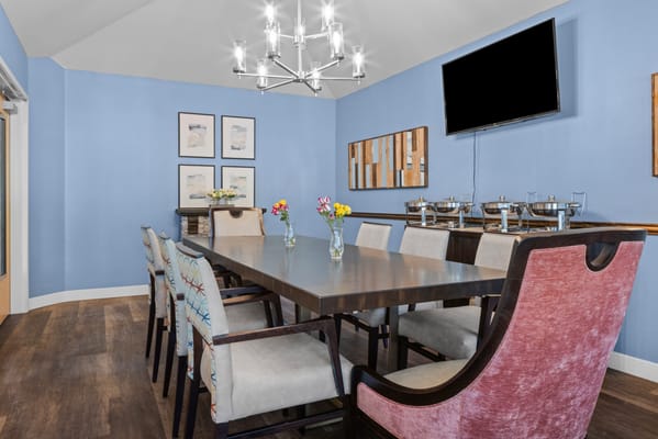 Common area with dining table and colorful decor