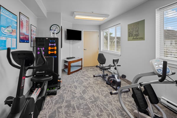 Exercise equipment in a well-lit activity room