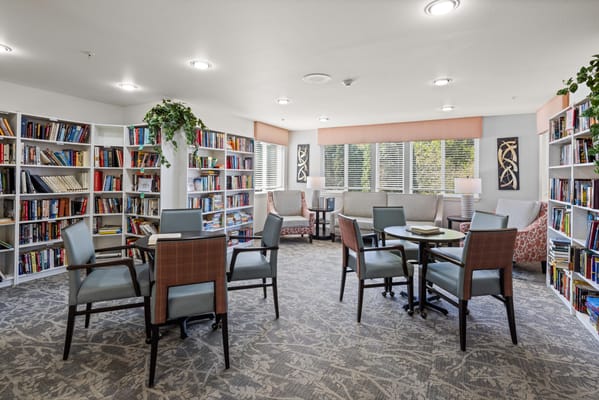 Bright and welcoming common area with bookshelves