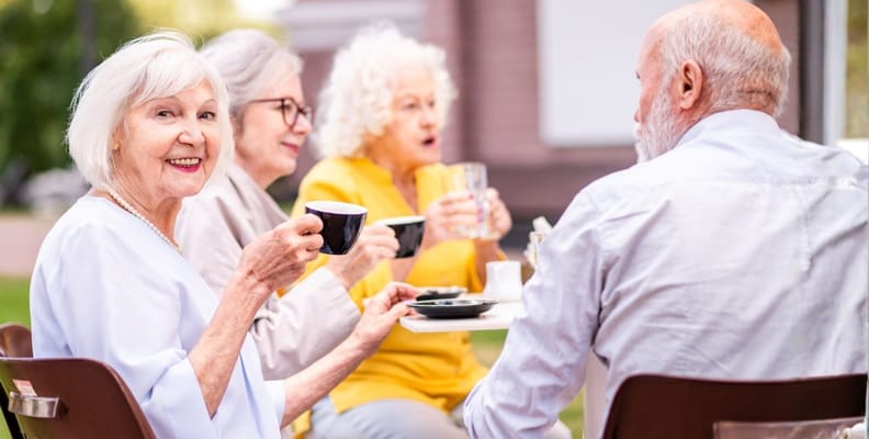 Residents enjoying coffee together outdoors
