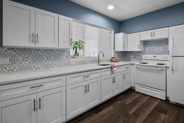 Bright, modern kitchen with white cabinets