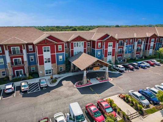 Aerial view of The Welstone at Mission Crossing building and parking lot