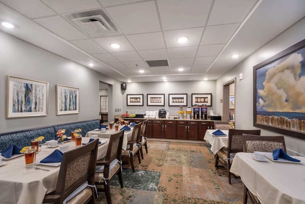 Dining room setup with tables and flowers