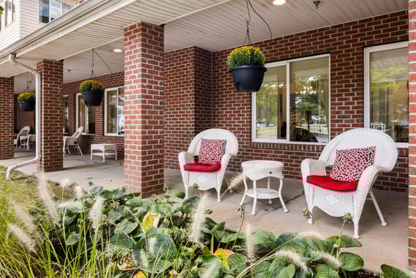 Outdoor seating area with decorative chairs and plants