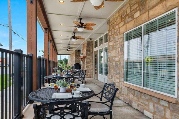 Outdoor dining area with tables and food setup