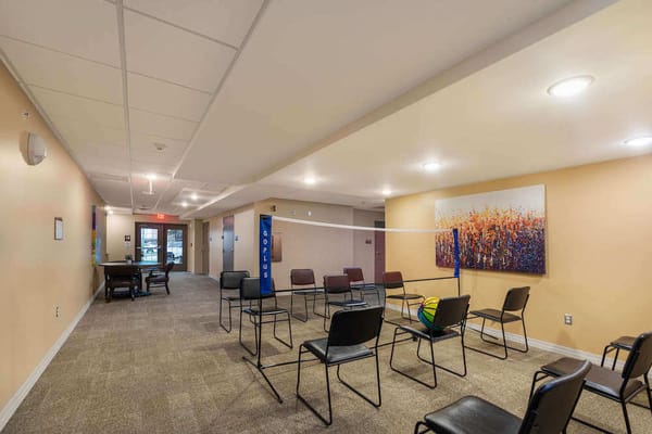 Interior view of an activity room set up for volleyball