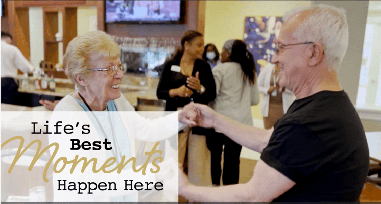Residents enjoying a dance in a lively common area