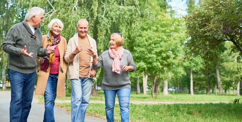 Residents taking a stroll in a green outdoor space