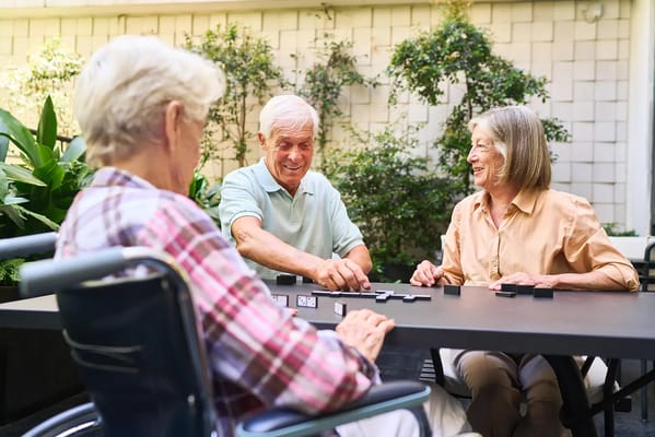 Residents playing a game outside in the garden