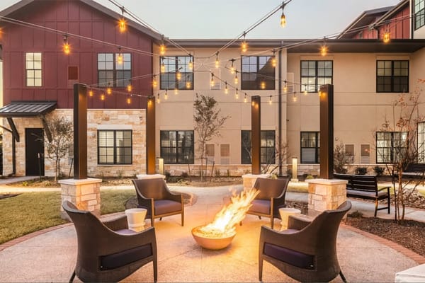 Outdoor lounge area with fire pit and seating