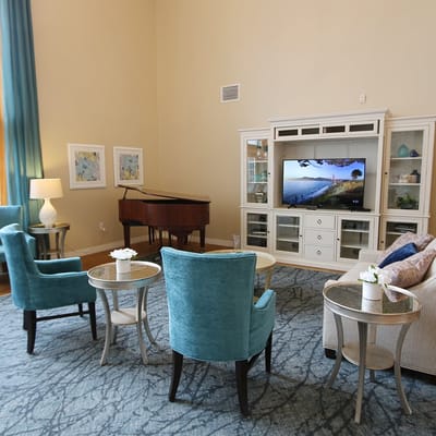 Cozy common area with seating and piano