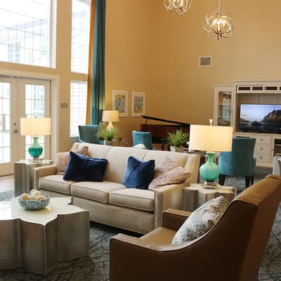 A brightly lit common area with comfortable seating