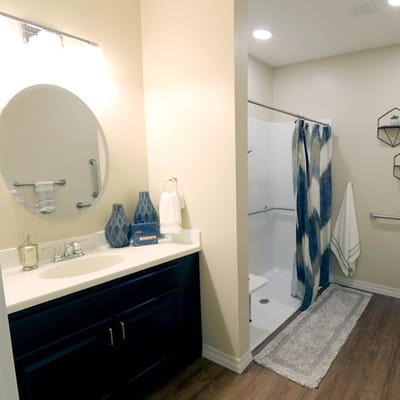 Bright, modern bathroom in a resident suite