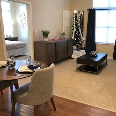 Interior view of a decorated common area with a dining setup