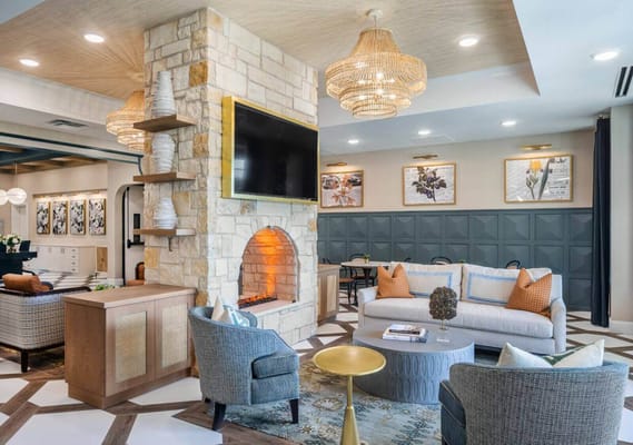 Interior lounge area with a cozy fireplace and seating