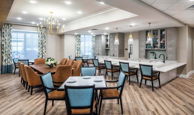 Bright dining area with wooden tables and chairs