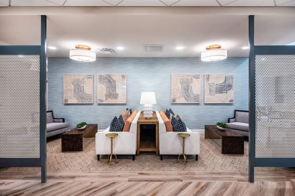 Comfortable common area with seating and artwork