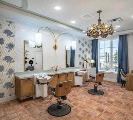 Bright and modern hair salon area with styling stations