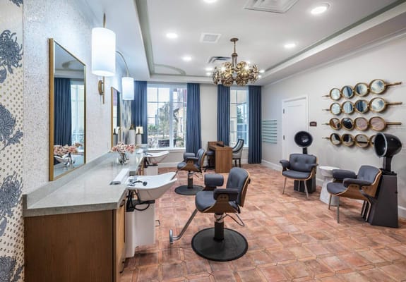 Interior view of a salon area with styling chairs