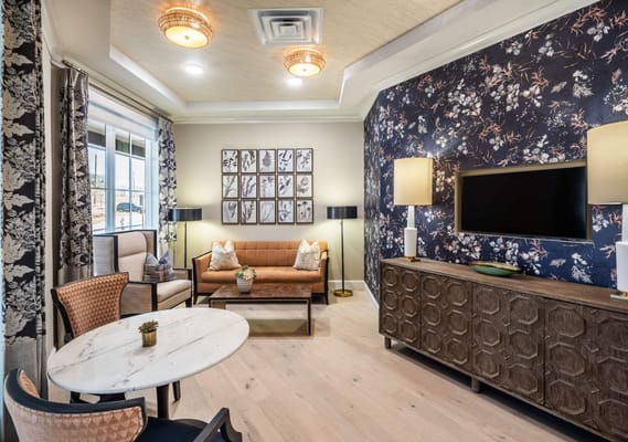 Common area with seating and decorative wallpaper