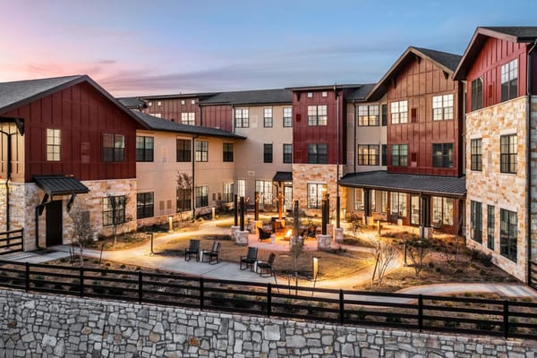 Exterior view of Longleaf Bee Cave at sunset