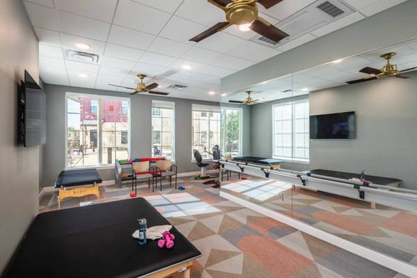 Therapy room with exercise equipment and natural light