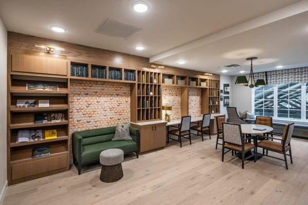 Interior common area with seating and bookshelves