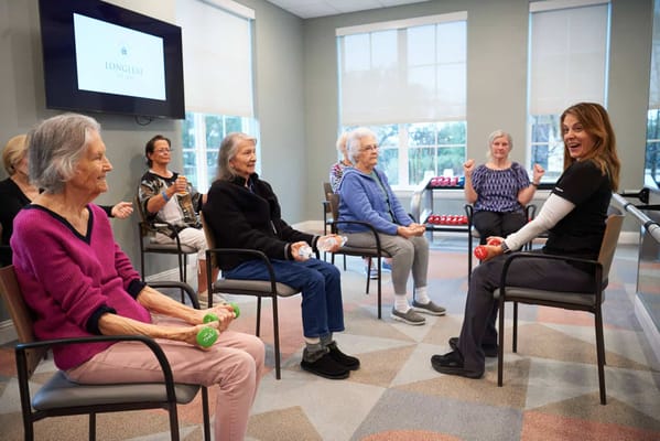 Residents participating in a light exercise class