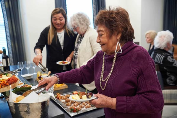 Residents enjoying a meal together during an event
