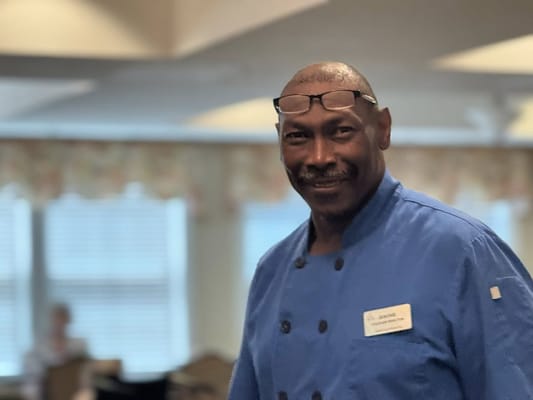 Staff member smiling in a common area