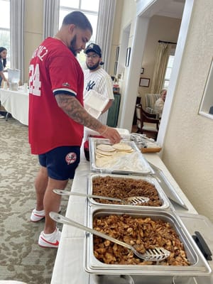 Residents enjoying a taco meal together