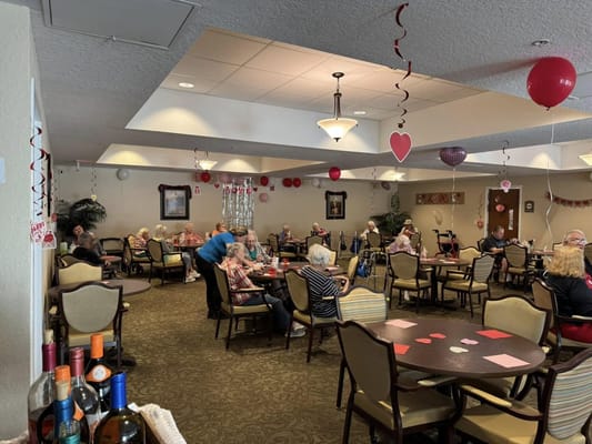 Residents enjoying an activity in a decorated common area