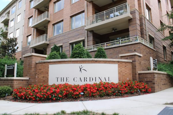 Exterior view of The Cardinal building with signage