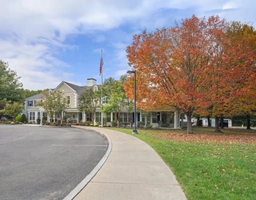 Exterior view of Allerton House with colorful autumn tree