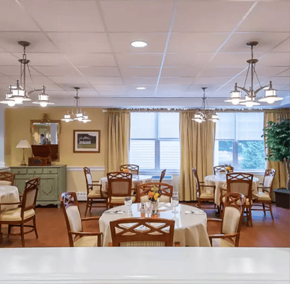 Bright dining area with tables and chairs