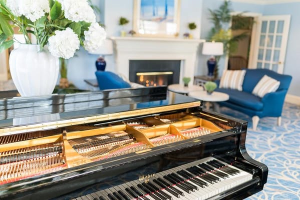 Elegant piano in a common area with floral decor