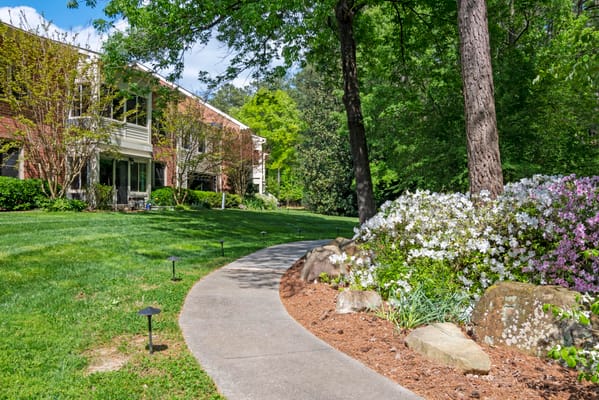 Pathway through a landscaped garden at the facility