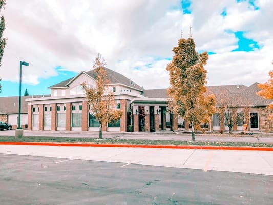 Exterior view of Family Tree Assisted Living building with trees