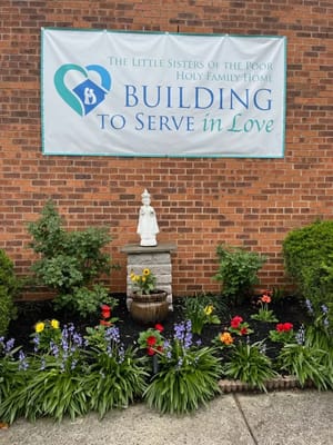 Outdoor garden area with a statue and plants