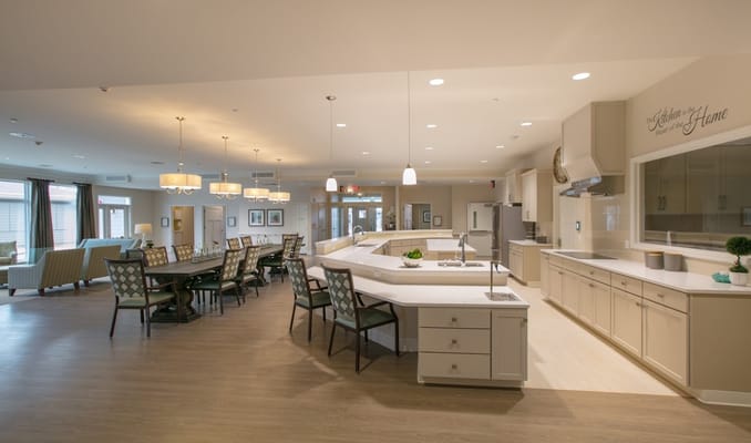 Bright and spacious common area with dining setup