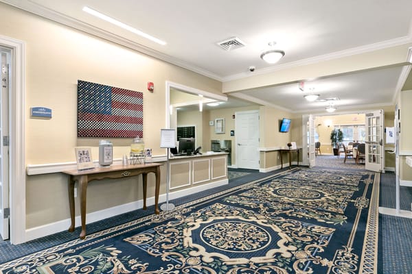Interior hallway with decorative carpet and American flag artwork