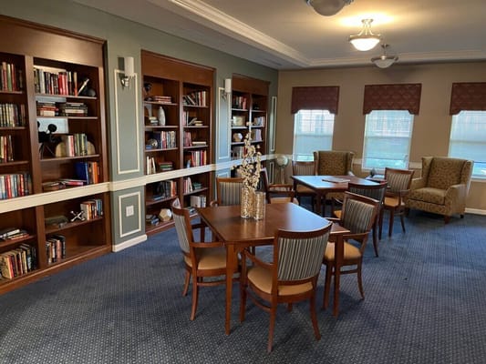 Cozy library area with bookshelves and seating