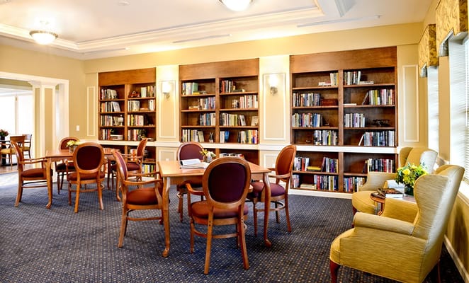 Cozy common area with bookshelves and seating