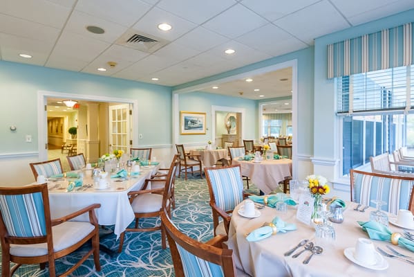 Bright dining room with elegantly set tables
